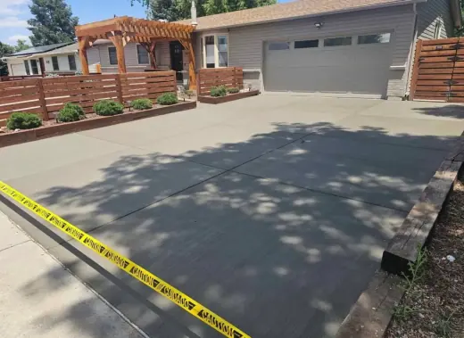 Driveway beside cedar planters and a slat fence, A & M Contracting