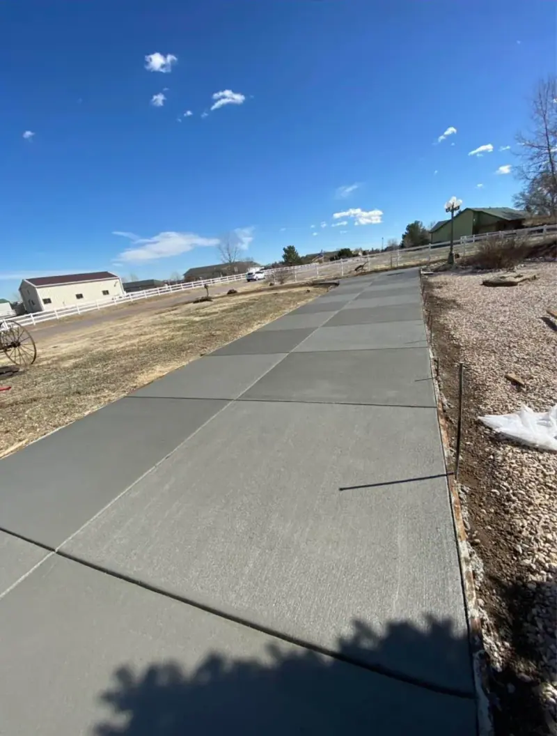 Long driveway poured across open ground, A & M Contracting