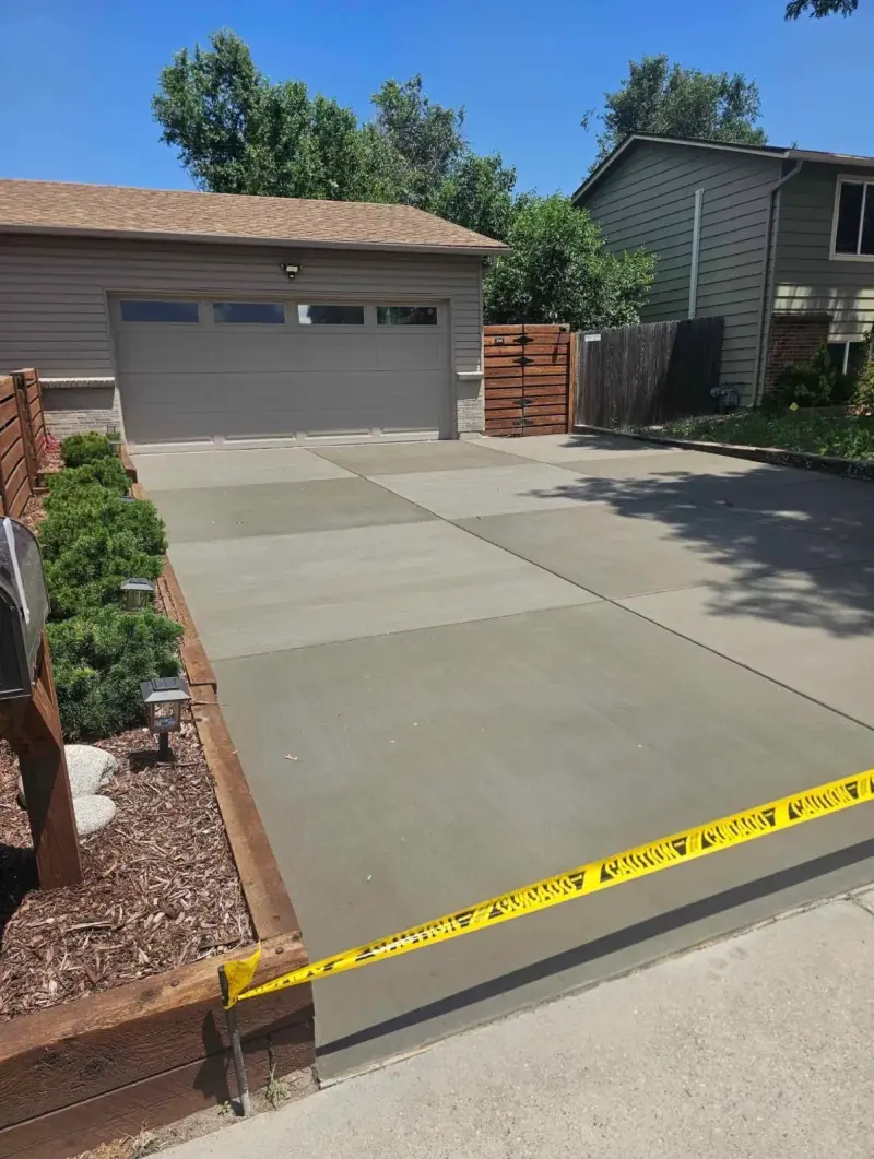 New driveway taped off while it cures, A & M Contracting