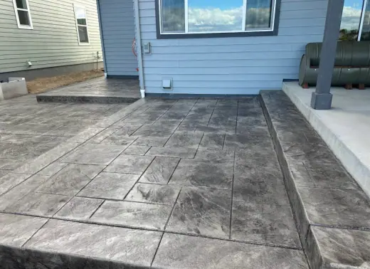 Stamped patio wrapping a covered porch, A & M Contracting