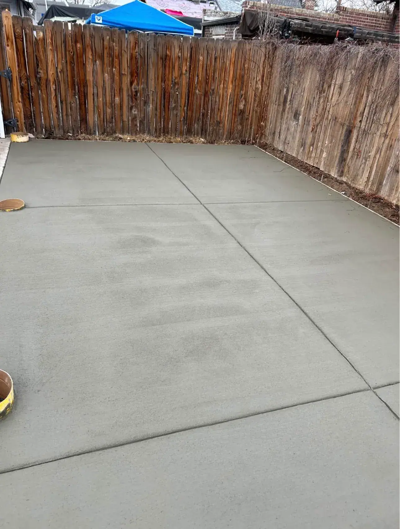 Smooth patio slab inside a wood fence, A & M Contracting
