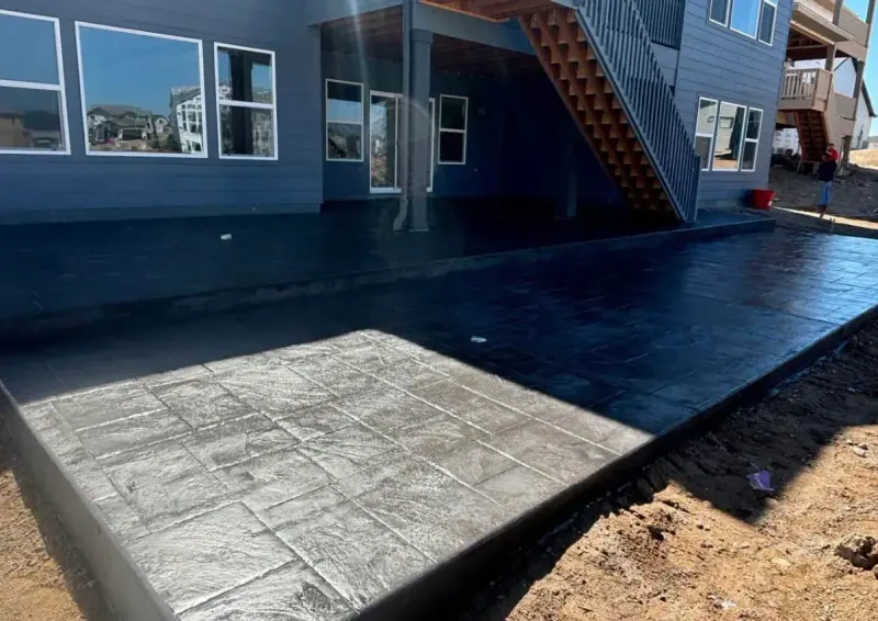 Dark stamped patio under a deck, A & M Contracting