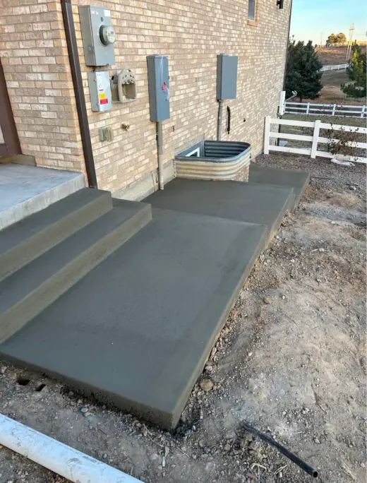 Steps and landing at the side of a brick home, A & M Contracting