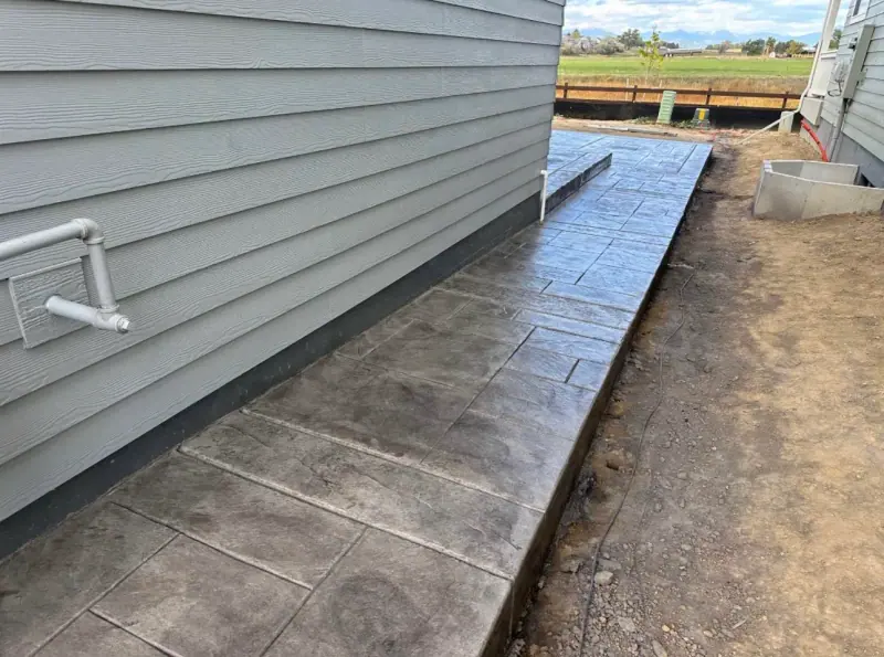 Stamped walkway along the side of a house, A & M Contracting